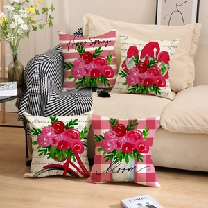 Détail de quatre coussins en lin avec imprimés floraux rouges et motifs Happy Spring