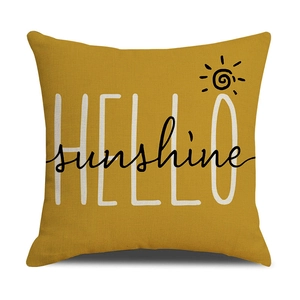 Detail showing high-quality linen texture with Hello Sunshine print on yellow pillow cover