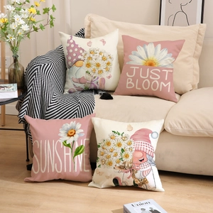 Detailed texture of 4-pack linen pillow covers featuring gnomes and floral designs