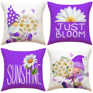 Detailed view of four purple linen pillow covers with gnome and daisy flower prints