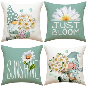 Set of 4 sage green linen cushion covers with daisy patterns and artistic lettering