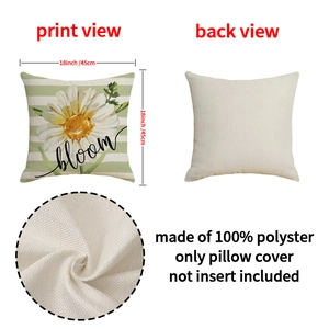 Detail view of linen texture cushion cover with daisy print and bloom lettering