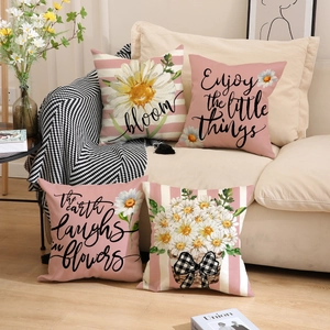Set of 4 linen pillow covers with daisy floral prints and elegant cursive lettering