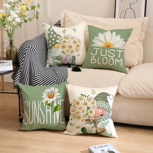 Detail of 4 linen pillow covers featuring floral daisies and garden gnome illustrations