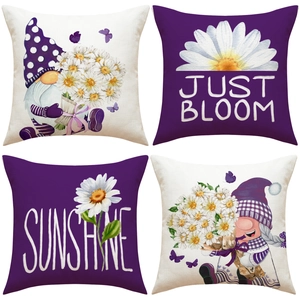 Detailed close-up of four linen pillow covers featuring gnomes and daisy floral patterns