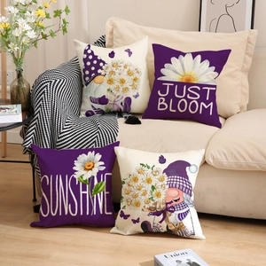 Detail of four decorative linen pillowcases with purple daisy and gnome illustrations