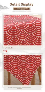 Close-up of red linen table runner with white wave pattern and detailed hand-rolled edges