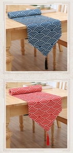 Detail of embroidered wave patterns and tassels on premium cotton linen table runner