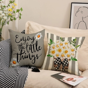 Minimalist daisy printed cushion covers set with linen texture on a beige sofa