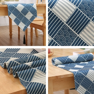 Modern New Chinese table runner with geometric wave pattern and black tassels decoration