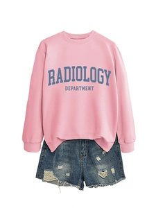 Detail of pink radiology department sweatshirt with vintage print and denim shorts