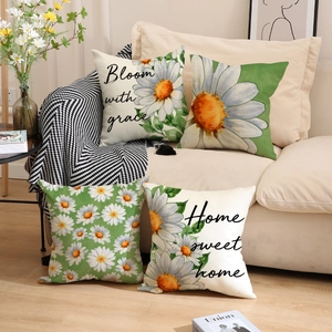 Daisy floral decorative pillow covers set of 4 with Bloom with grace text on sofa