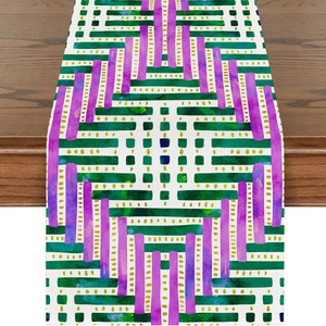 Close-up of linen table runner with colorful abstract geometric moon prints on wood table