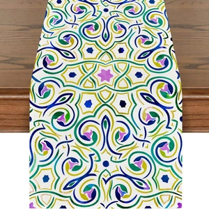 Close-up of linen table runner with colorful moon and geometric floral print on wood