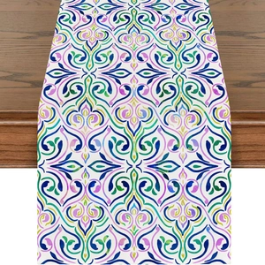 Close-up of linen table runner featuring colorful Middle Eastern moon damask patterns