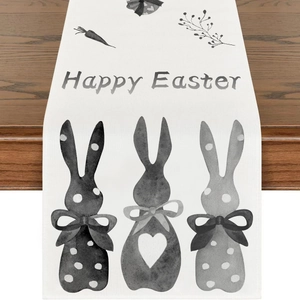 Macro shot of Happy Easter linen table runner featuring watercolor bunny and carrot motifs