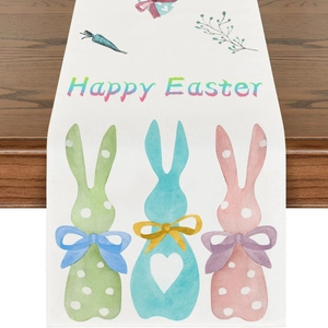 Close-up of Easter table runner with colorful polka dot bunnies and Happy Easter print