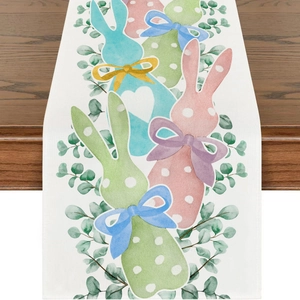 Detail of Easter linen table runner featuring cute watercolor bunnies and green leaves