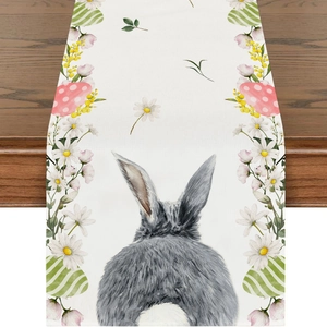 Detail of Easter table runner featuring watercolor rabbit and colorful eggs on linen fabric