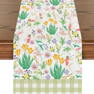 Detail of Easter table runner with cute rabbit prints and green plaid edge on wood