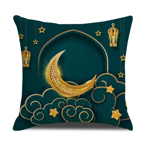Detail of Eid Moon and lantern print on green linen cushion cover for festive decor