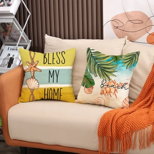 Summer ocean themed pillow covers with Beach and Bless My Home prints on sofa