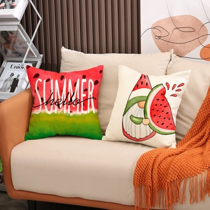 Close-up of watermelon summer gnomes linen pillow covers on a cozy sofa