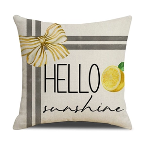 Dettaglio federa in lino con stampa a limone e fiocco e scritta HELLO sunshine
