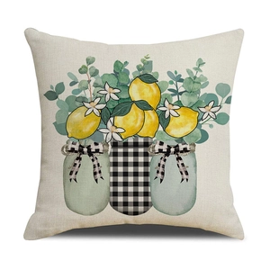 Detail of linen cushion cover with rustic lemon print and woven fabric texture