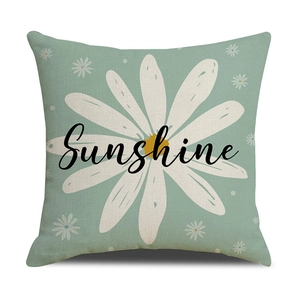 Detailed texture of mint green linen pillowcase with daisy print and Sunshine text