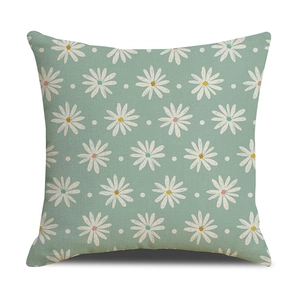 Detailed macro view of small white daisy pattern on sage green linen pillowcase fabric