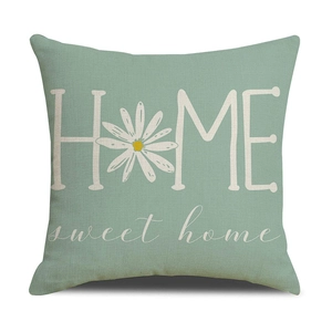 Detail of sage green linen pillowcase with white HOME sweet home daisy floral print