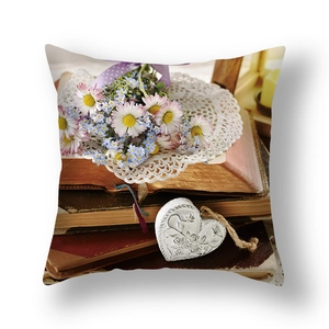 Detail of the vintage floral pillow case featuring rustic books and flower bouquet print