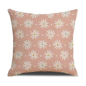 Detailed view of linen pillowcase featuring white daisy prints and natural texture