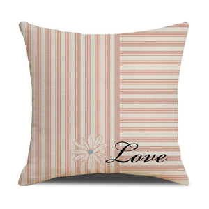 Close-up of pink daisy and Love print on striped linen texture decorative pillowcase