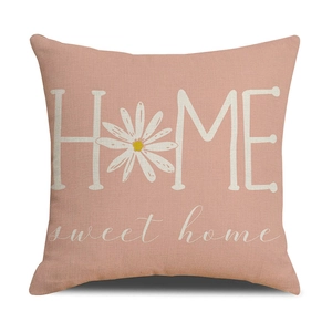 Detail of pink linen pillowcase with daisy print and Home sweet home text design