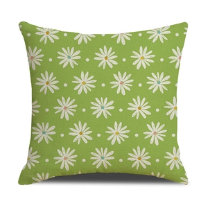 Detail of green linen pillowcase with daisy print and textured fabric weave
