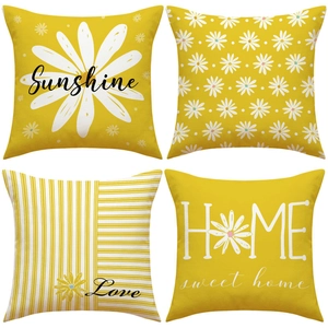 Detail view of 4-pack yellow daisy linen pillow covers with sunshine and floral patterns