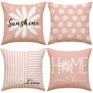 Set of four daisy floral pillow covers with Sunshine and Home text in pink and white