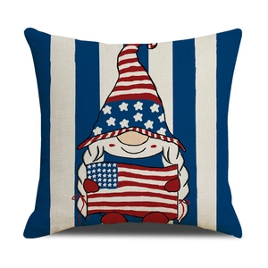 Detailed view of patriotic gnome and US flag print on striped linen pillow cover