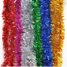 Close-up of vibrant multicolored tinsel garlands for festive Christmas tree decoration