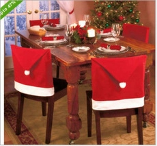 Red Christmas hat chair covers set shown in a cozy festive dining room setting