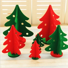 Detail of red and green DIY 3D felt Christmas tree ornaments with hollow design