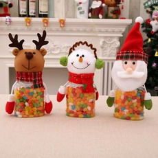 Three-piece Christmas candy jars featuring Santa, Snowman, and Reindeer plush designs