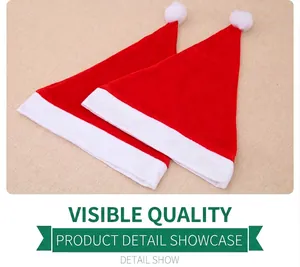 Close-up of premium red velvet Christmas hats with plush white trim and fluffy pom-poms