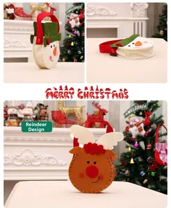 Detail of Christmas felt gift bags with reindeer and snowman designs and red handles
