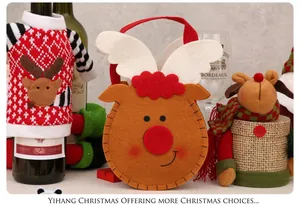 Christmas decoration set with elk knit bottle cover and brown felt gift bag on wood