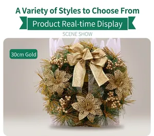 Detailed view of a 30cm green Christmas wreath with gold bows and ornaments