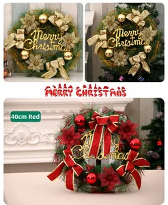 Detail of 40cm Christmas wreath with Merry Christmas lettering, gold bows and red baubles
