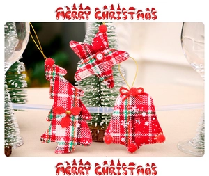 Detailed view of Scottish plaid fabric Christmas ornaments featuring tree and star shapes